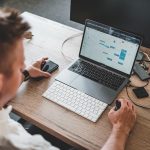 Becoming a better software manager, man in front of laptop screen