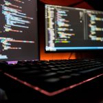 Software code across screen with keyboard foregrounded