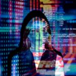 Code appears overlaid a picture of a software engineer's face