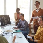 BSPOKE Software - Group of people discussing outsourcing or outstaffing their company's software development project