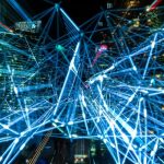Graphic overlay of blue lines against cityscape representing machine learning and AI