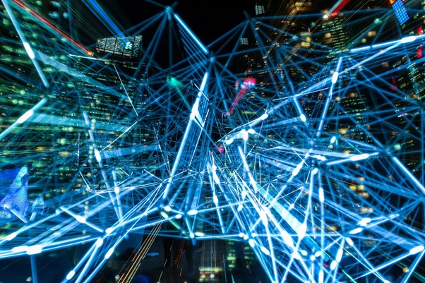 Graphic overlay of blue lines against cityscape representing machine learning and AI