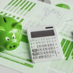 BSPOKE Software - Small business finanace, shows calculator and piggy bank representing managing your finances with custom software