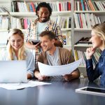 Group of software developers with clients