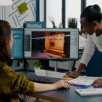 BSPOKE Software - Shows two developers testing custom software for a business project
