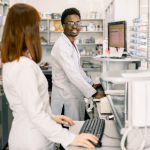 BSPOKE Software - Shows healthcare workers using a custom software system in a pharmacy