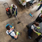 BSPOKE Software - Employees cleaning an office who use bespoke software for a cleaning business