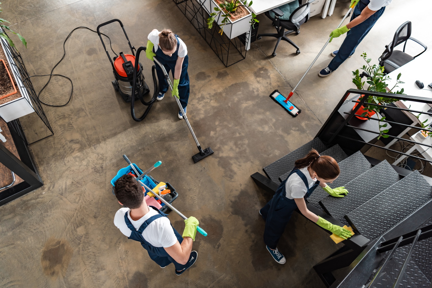 BSPOKE Software - Employees cleaning an office who use bespoke software for a cleaning business