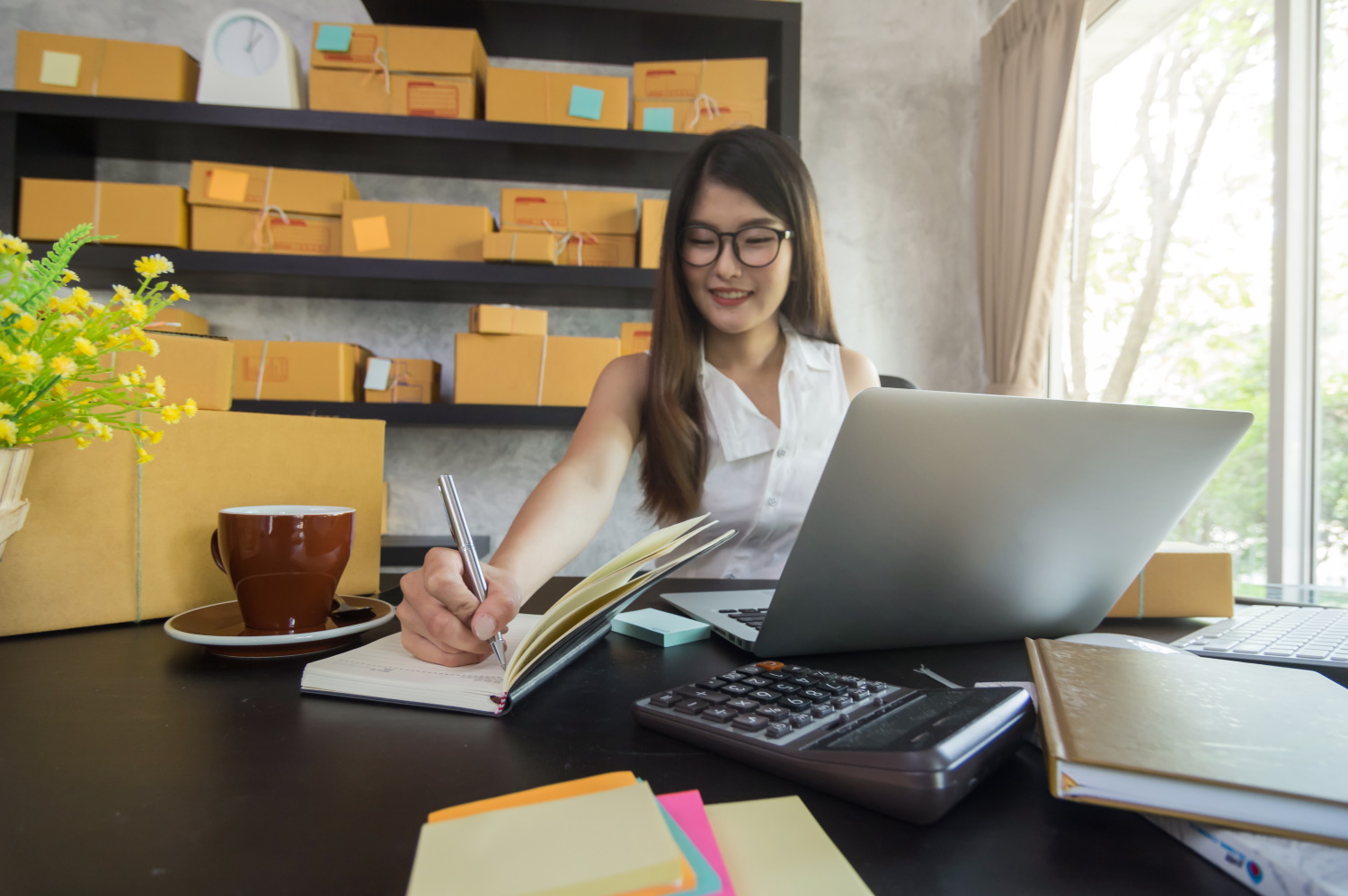 BSPOKE Software - Retail online office with girl working on computer using bespoke software for a retail business