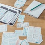 BSPOKE Software - Photo of paper prototypes for a custom software solution, illustrating app prototyping.
