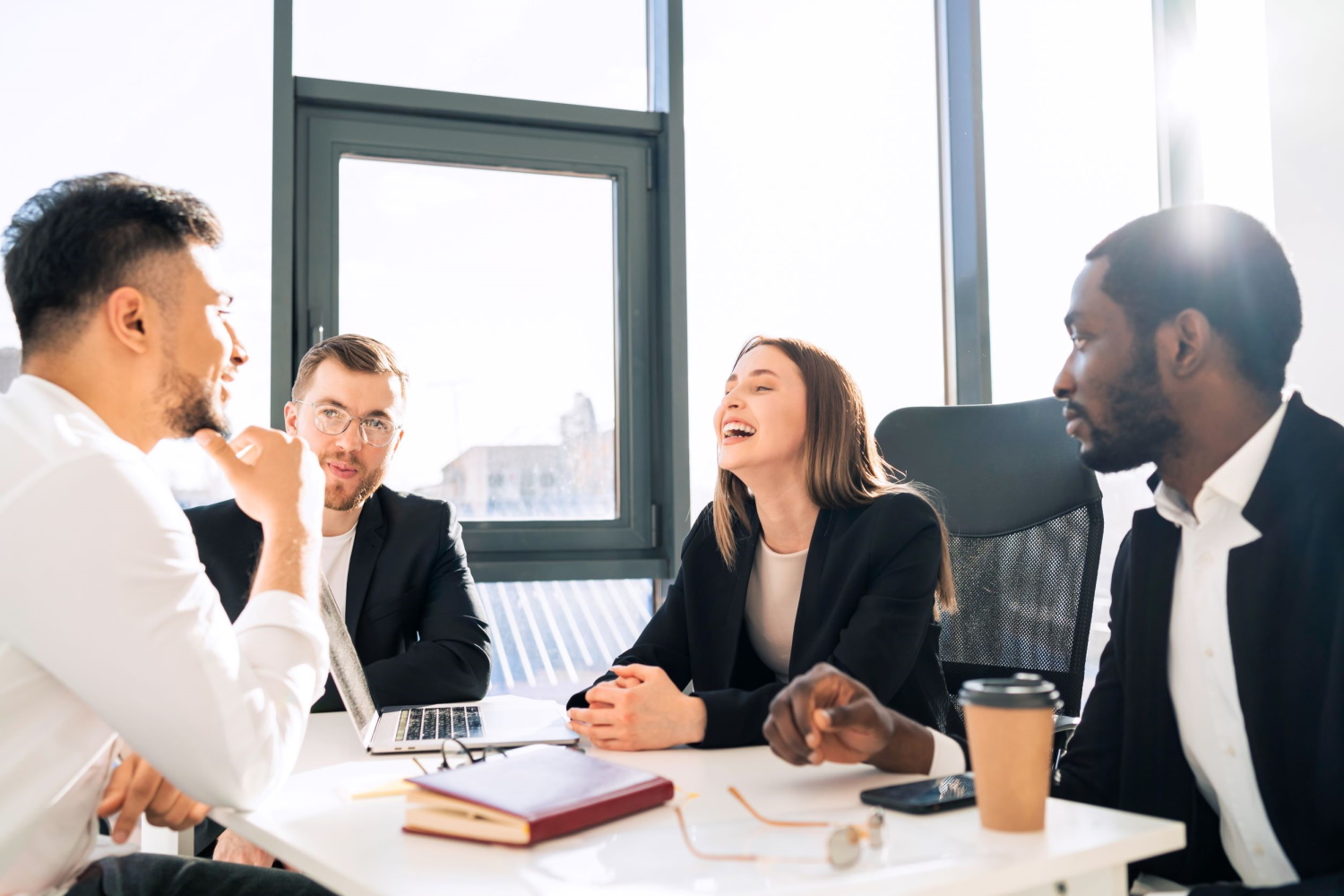 BSPOKE software - Bespoke software development services  developers discussing a software project with clients.